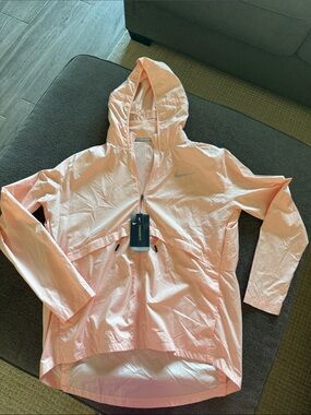 Nike Women’s Light Peach Hooded Windbreaker Jacket